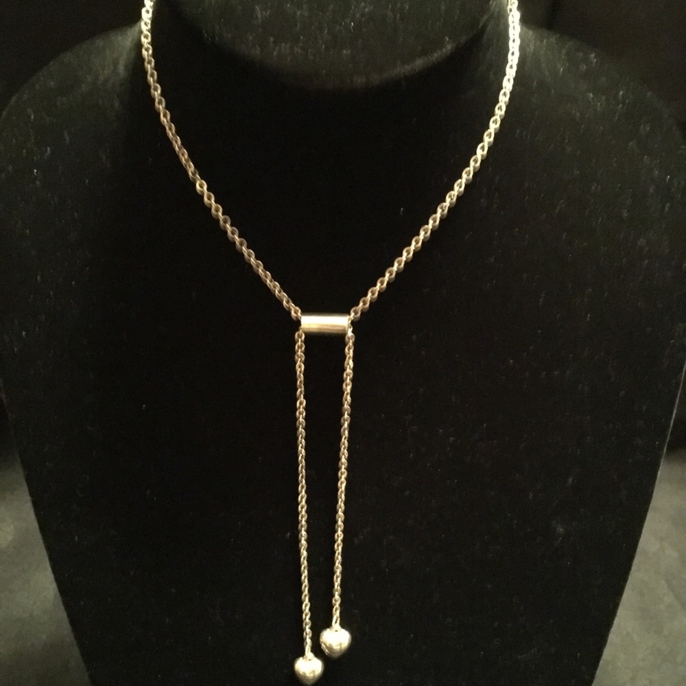 Silver metal necklace with heart pendant